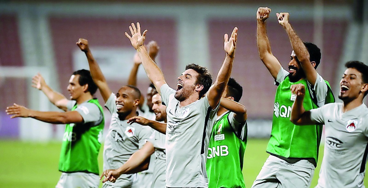 Al Rayyan players celebrate after beating Al Arabi in the Amir Cup quarter-final, yesterday.