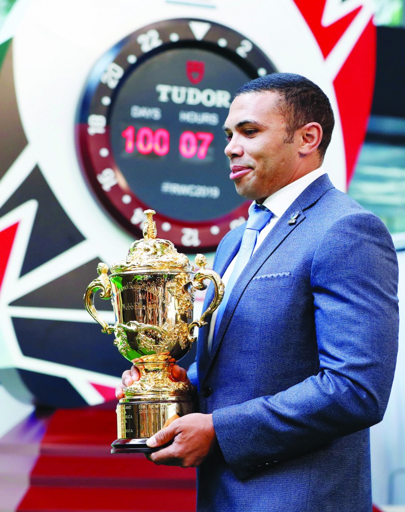 South Africa's Bryan Habana holds the Webb Ellis Cup trophy as he arrives at an event to mark the final 100 days to go for Rugby World Cup 2019 kick off in Japan, in Tokyo, Japan June 12, 2019. Reuters/Issei Kato 