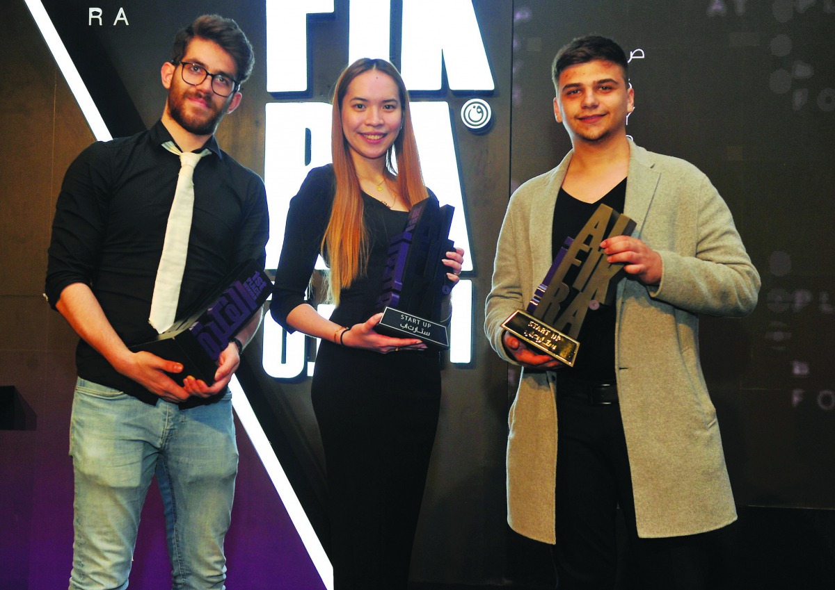 AWALAN team members, FROM LEFT: Mohamed Amara; Johanne Medina; and Keivin Isufaj posing with their Al-Fikra Awards. Pic: Abdul Basit / THE PENINSULA