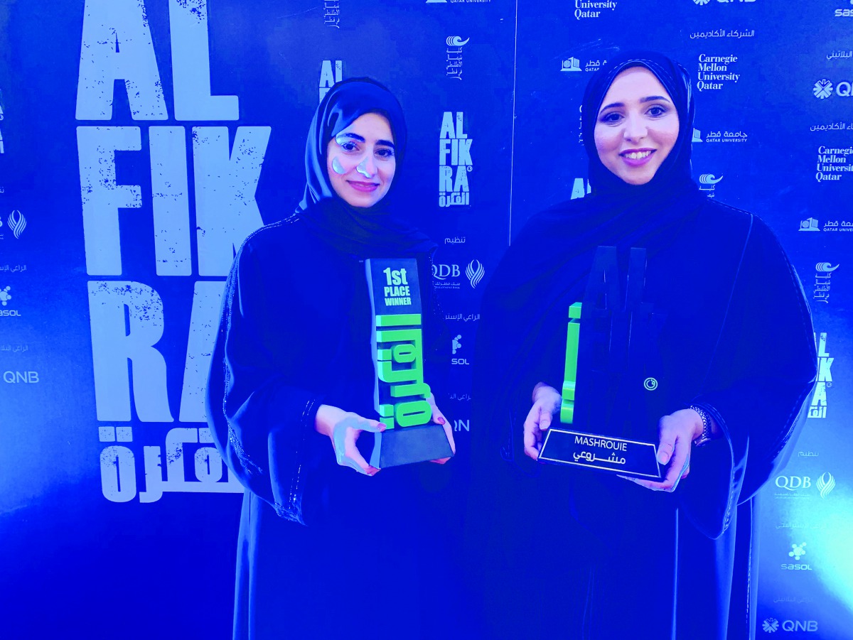 Zakeia Al Yafei (right), and Lubna Marwan posing with their awards after winning the Al Fikra Mashroie Award for university students category, in Doha recently. 