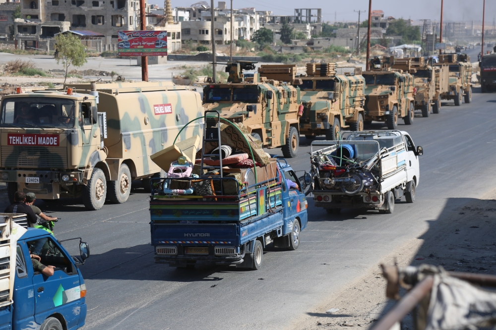 Turkish military convoy is seen on August 19, 2019 in Syria's northern province of Idlib. ?zzettin Idilbi - Anadolu 