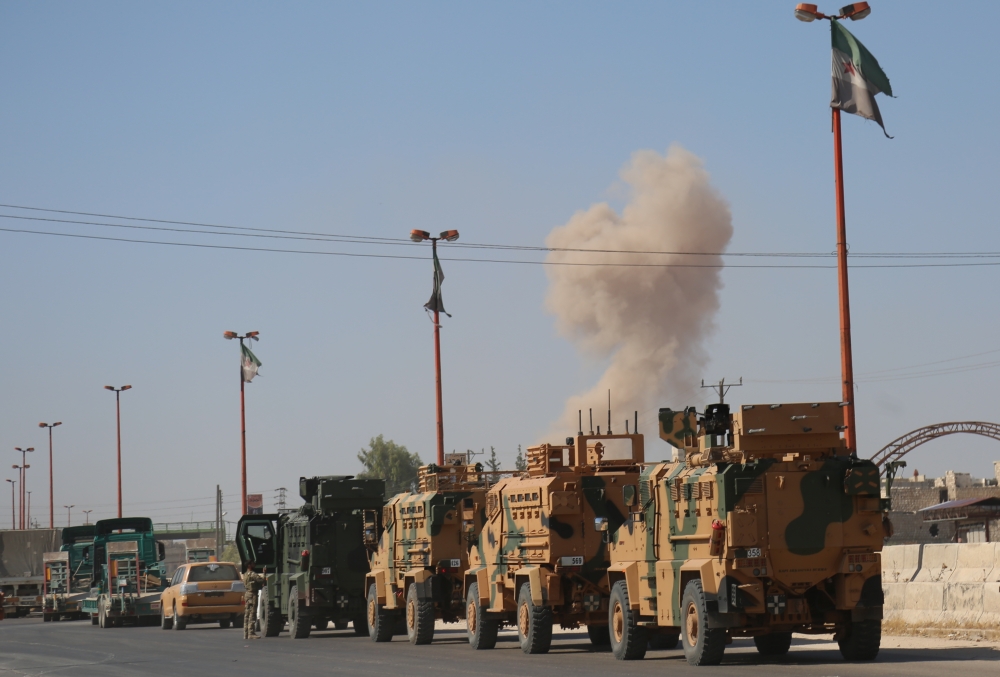 Turkish military convoy is seen on August 19, 2019 in Syria's northern province of Idlib.  ?zzettin Idilbi - Anadolu