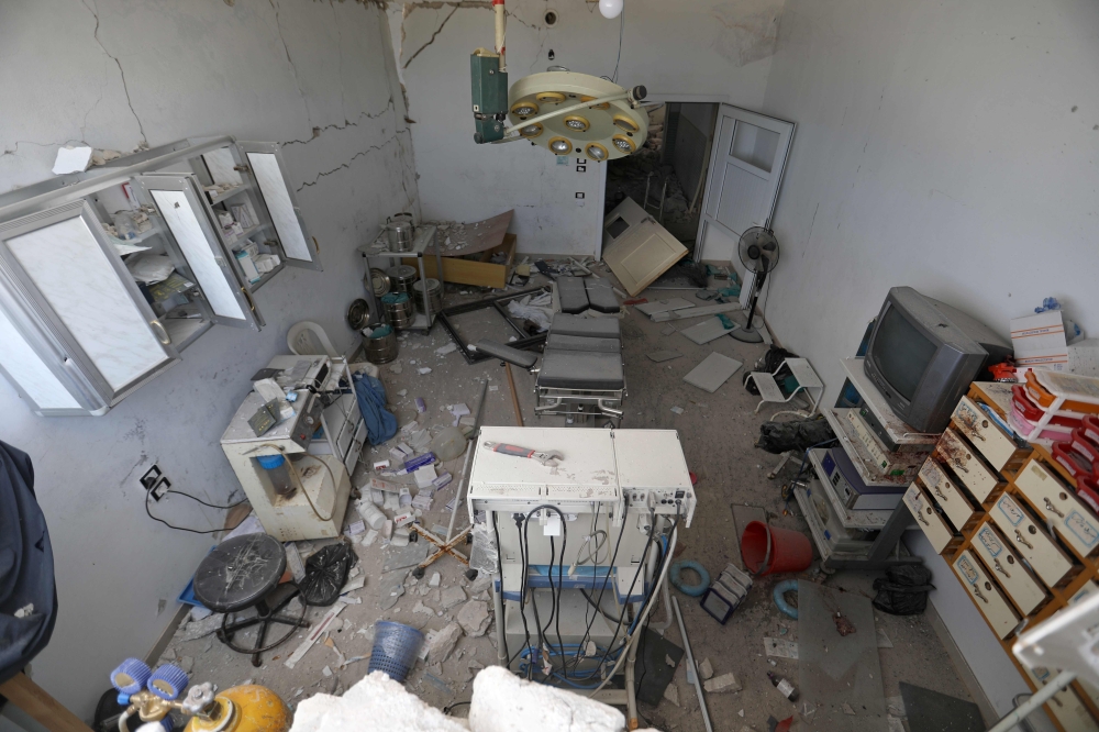 This picture taken on August 21, 2019 shows the damaged interior of an operating room following a reported air strike on a makeshift clinic in the area of Tallmannis in Syria's northern Idlib province3 / AFP / Abdulaziz KETAZ