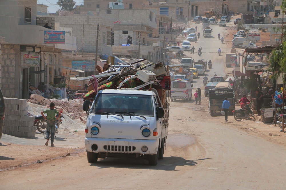 Syrians, with their belongings, are seen on their way from Syria’s de-escalation zones in Idlib, Syria on August 21, 2019. Hüseyin El Huleyf - Anadolu