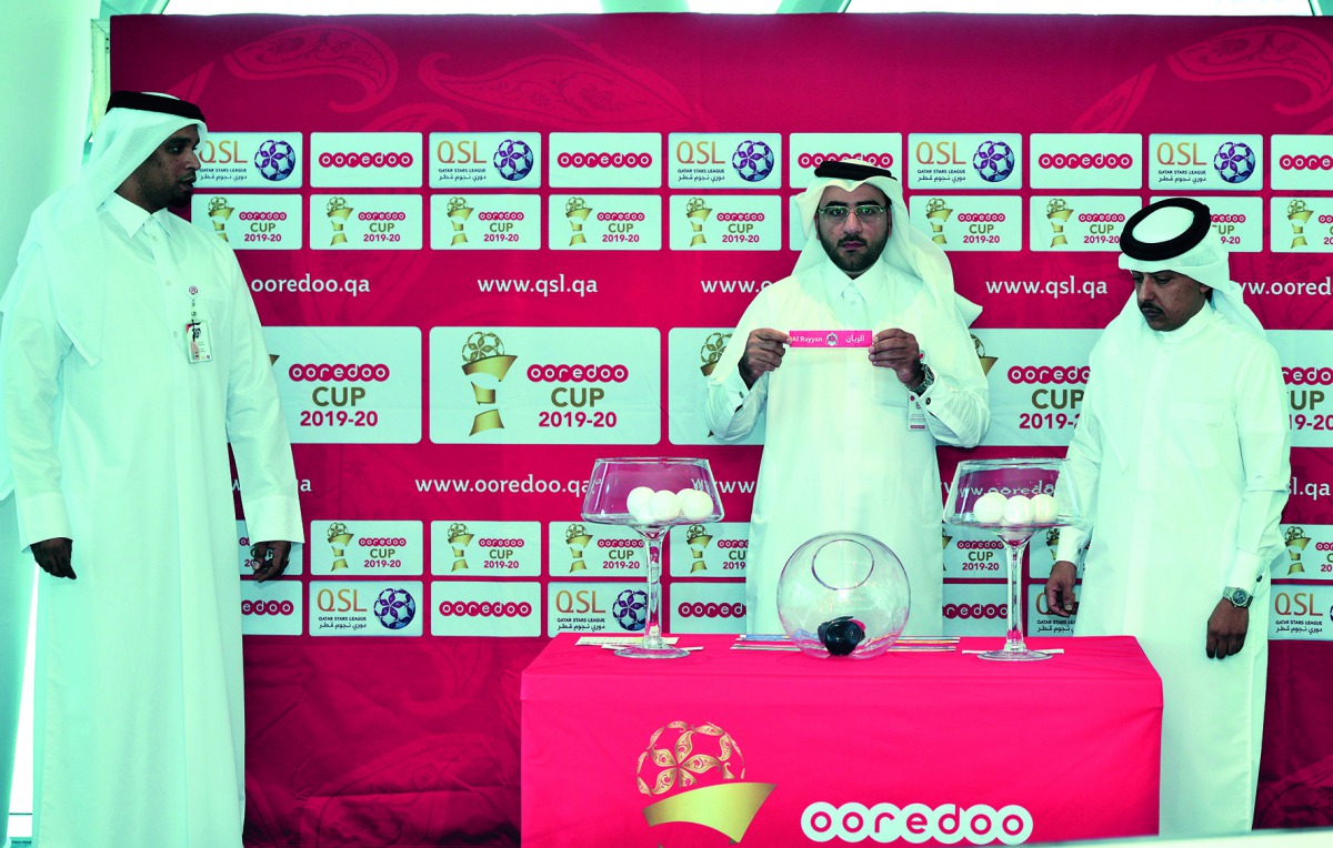 Ahmed Al Adsani, Director of Competitions Department at Qatar Stars League and Mohammed Al Ansari, Director of Field Marketing and Activation at Ooredoo Qatar during the Ooredoo Cup draw ceremony yesterday. Pic: Abdul Basit/ The Peninsula