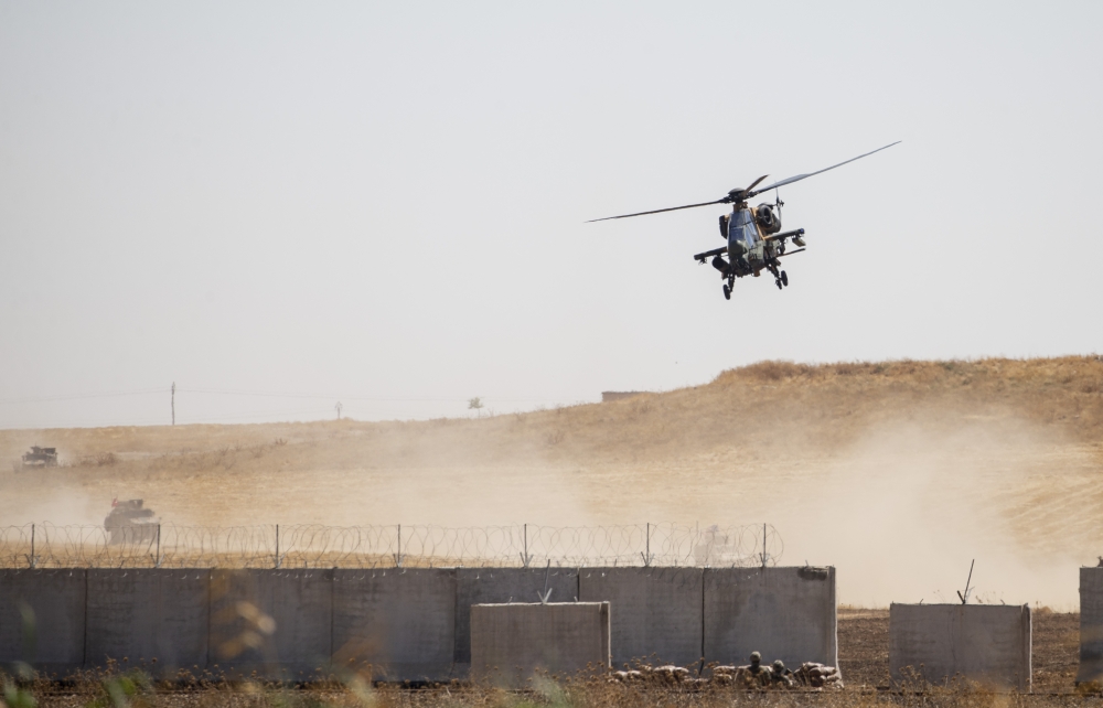 The armoured vehicles and helicopters as Turkey, US start first joint ground patrols as part of efforts to establish safe zone east of Euphrates in Syria on September 08, 2019. Emin Sansar - Anadolu 