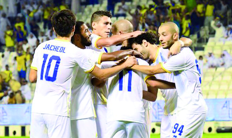 Al Gharafa players celebrate after scoring a goal during the QNB Stars League match in this file picture.