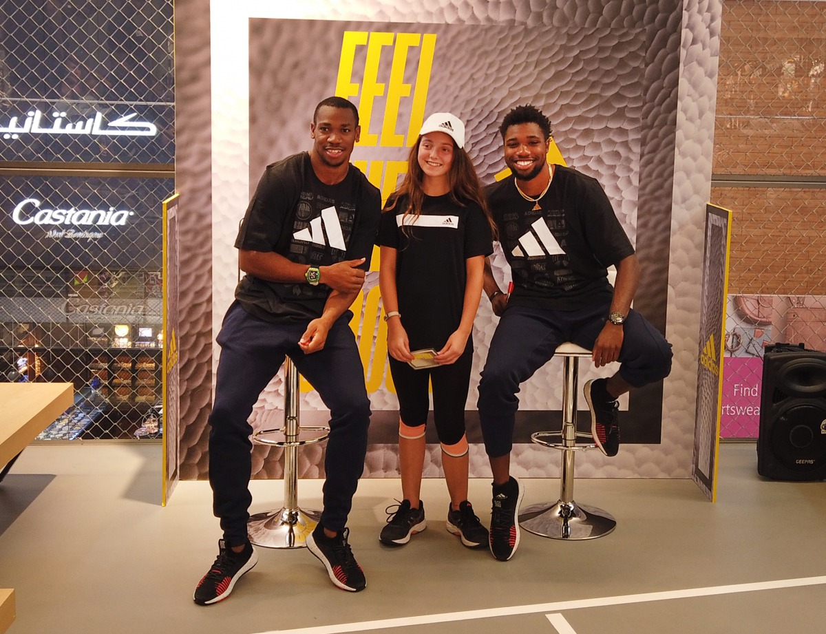 Former 100 metres world champion, Jamaica’s Yohan Blake (left) and United States’ sprinter Noah Lyles pose for a photograph with a student of Sherborne School Qatar at the Mall of Qatar in Al Rayyan, yesterday.  Picture: Armstrong Vas / The Peninsula 