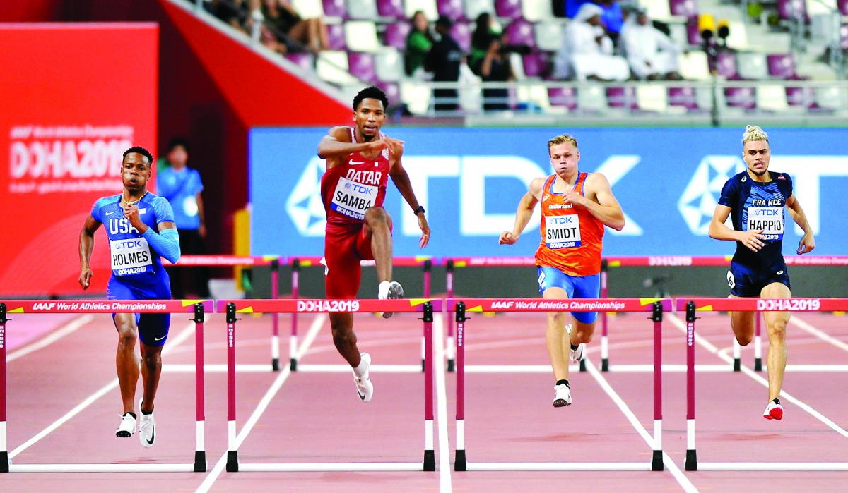 Qatar’s Abderrahman Samba (centre), TJ Holmes of the US and Netherland's Nick Smidt (right) compete during Men’s 400 Metres Hurdles Heats on the opening day of the 2019 IAAF World Athletics Championships at the Khalifa International Stadium. Picture: Abdu