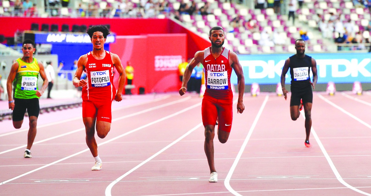 Qatar’s Owaab Barrow (centre) in action during the Men’s 100 Metres Preliminary Round at the Khalifa International Stadium in Doha, yesterday.