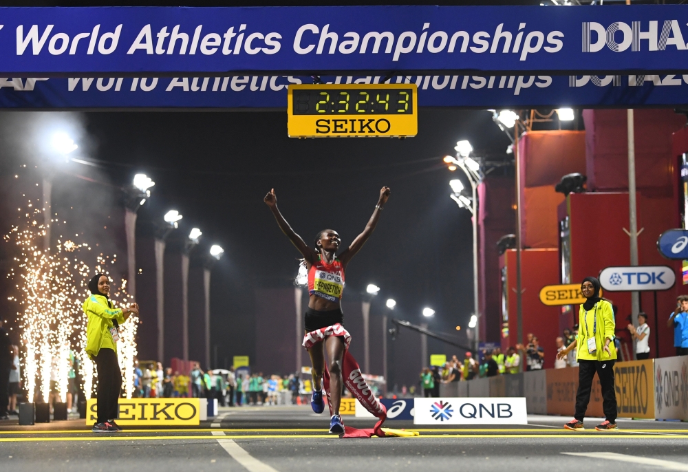 Kenya's Ruth Chepngetich crosses the line to win the race (REUTERS/Dylan Martinez)