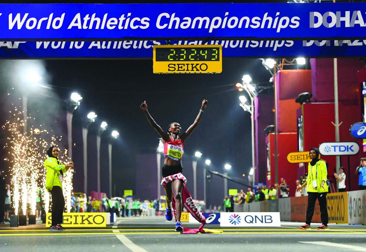 Kenya’s Ruth Chepngetich crossing the finish line to win the women’s marathon of the IAAF World Championships  at the Corniche in Doha, yesterday.