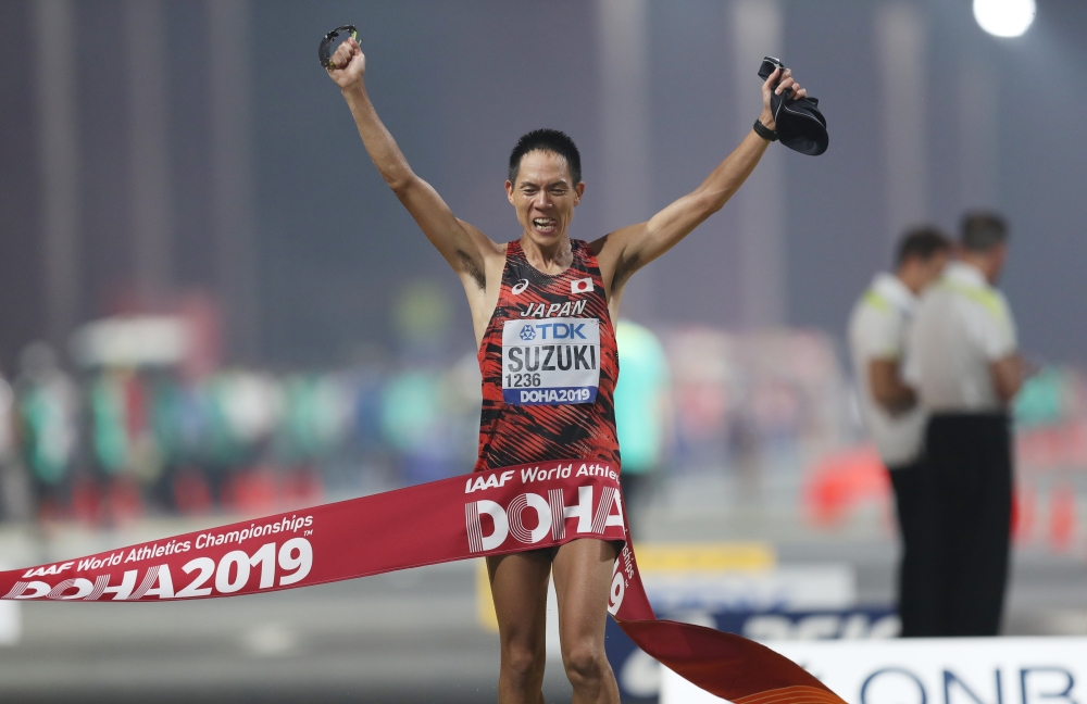 Japan's Yusuke Suzuki crosses the line to win gold REUTERS/Ibraheem Al Omari