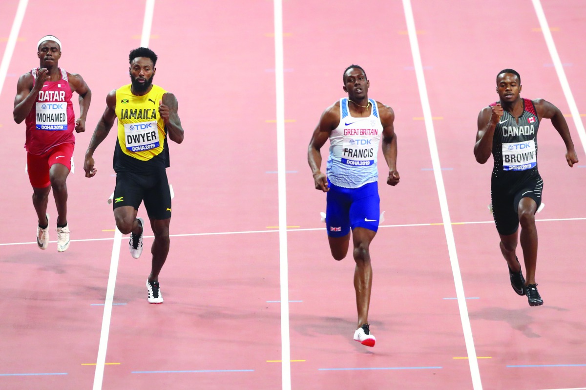 FROM LEFT: Qatar’s Abdelaziz Mohamed, Jamaica’s Rasheed Dwyer, Britain’s Miguel Francis and Canada’s Aaron Brown in action during the men’s 200 metres heats yesterday.