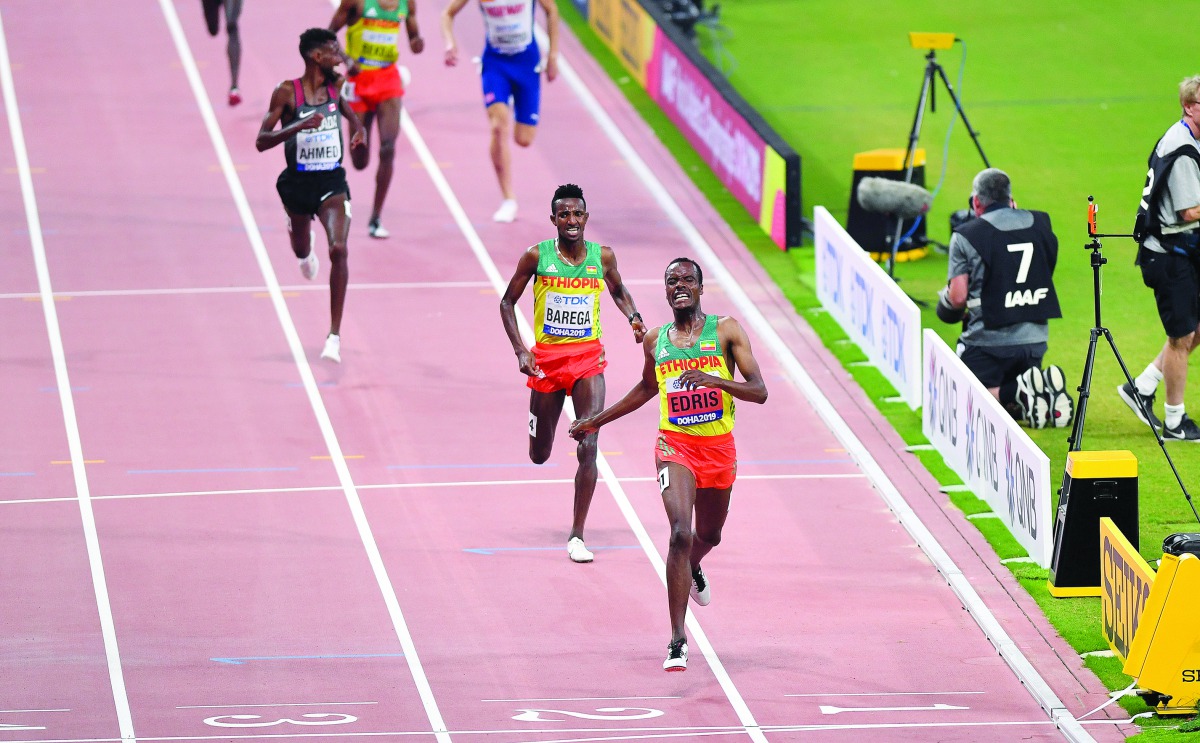 Ethiopia’s Muktar Edris (right) winning the men’s 5000 metres final during the 2019 IAAF Athletics World Championships in Doha, yesterday. Picture: Abdul Basit / The Peninsula