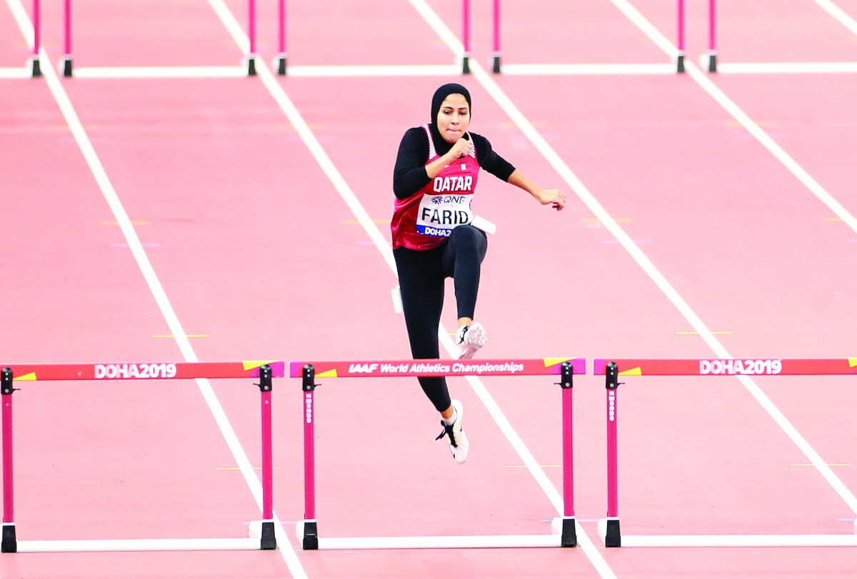 Qatar’s Mariam Farid in action during the women’s 400 metres hurdles heats yesterday. Picture: Abdul basit / The Peninsula