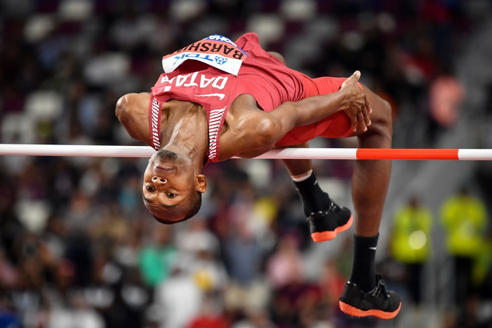 Qatar's Mutaz Essa Barshim competes in the Men's High Jump heats at the 2019 IAAF Athletics World Championships at the Khalifa International stadium in Doha on October 1, 2019. / AFP / ANDREJ ISAKOVIC