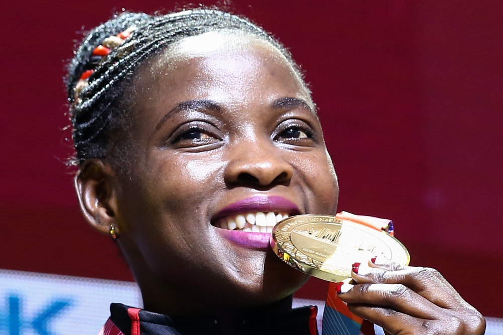 Gold medallist Uganda's Halimah Nakaayi poses on the podium during the medal ceremony for the Women's 800m at the 2019 IAAF World Athletics Championships at the Khalifa International Stadium in Doha on October 1, 2019. AFP / Mustafa Abumunes 