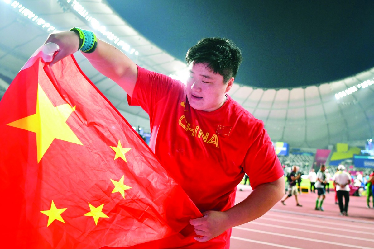 China’s Gong Lijiao celebrates after winning the women’s shot put final on Thursday.