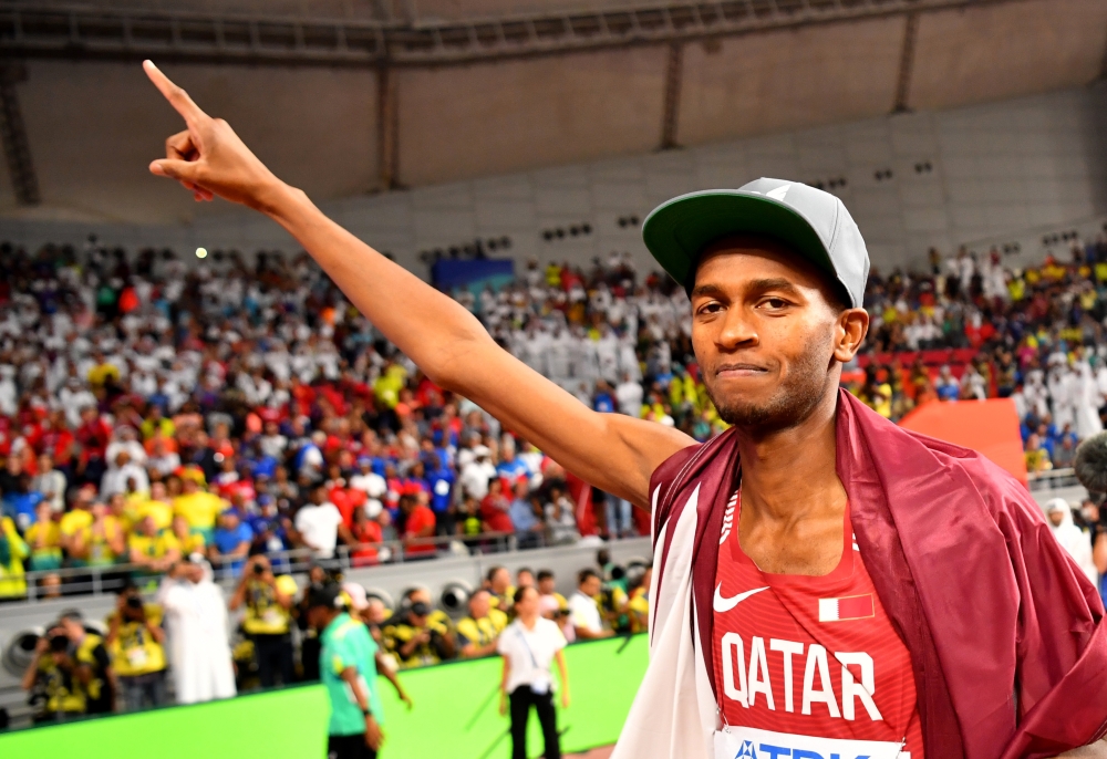 Qatar's Mutaz Essa Barshim celebrates winning gold REUTERS/Dylan Martinez