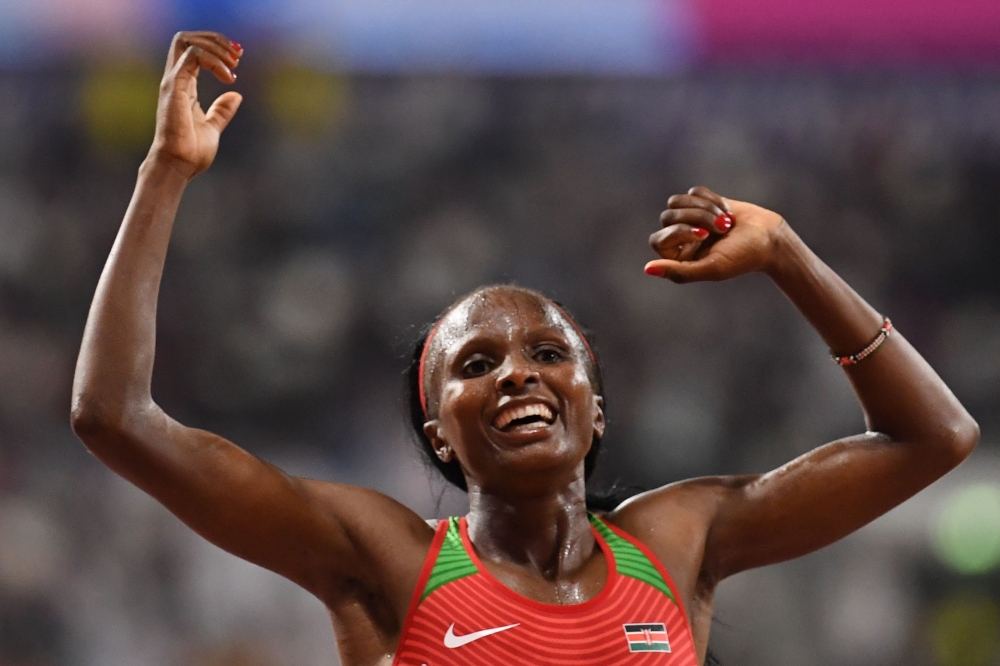 Kenya's Hellen Obiri celebrates winning the Women's 5000m final at the 2019 IAAF Athletics World Championships at the Khalifa International stadium in Doha on October 5, 2019. AFP / Jewel Samad 