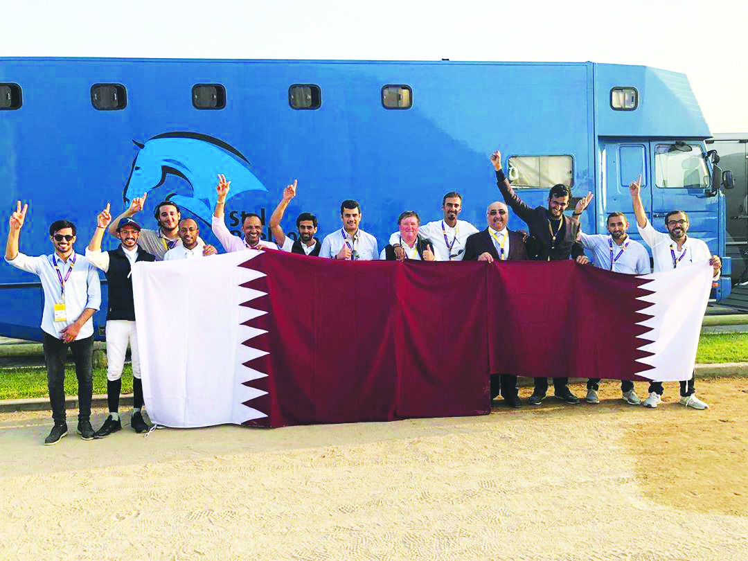 The members of the Qatari showjumping team, officials and supporting staff celebrate after winning the second place at the Olympic Qualifying event in Rabat, Morocco to book a ticket to Tokyo, yesterday.   