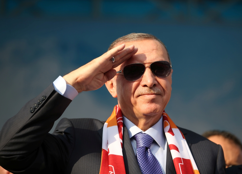 Turkish President Tayyip Erdogan salutes during a gathering in Kayseri, Turkey, October 19, 2019. 