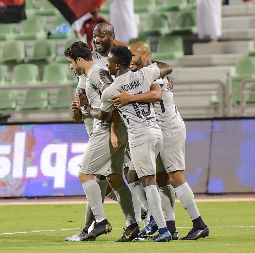 Al Rayyan’s Yacine Brahimi (right) celebrates with team-mates after scoring their second goal against Al Sailiya at the Al Ahli Stadium, yesterday.