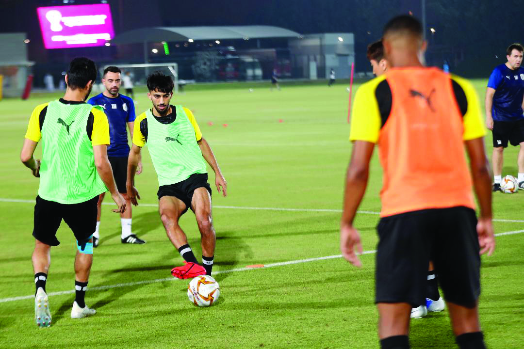 Al Sadd players train under the supervision of coach Xavi.