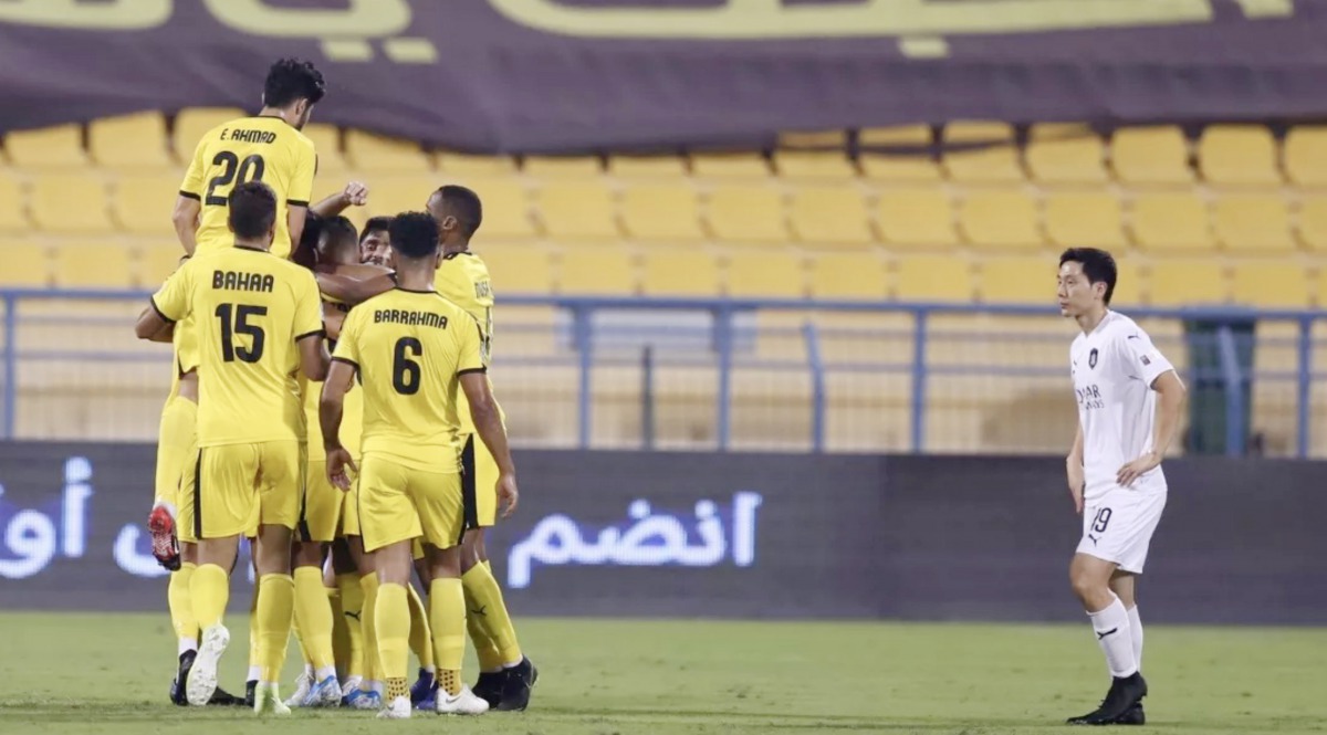 Qatar SC players celebrate after winning their QNB Qatar Stars League match against defending champions Al Sadd at Al Gharafa Stadium. Qatar SC won 3-0; Action from the same match.