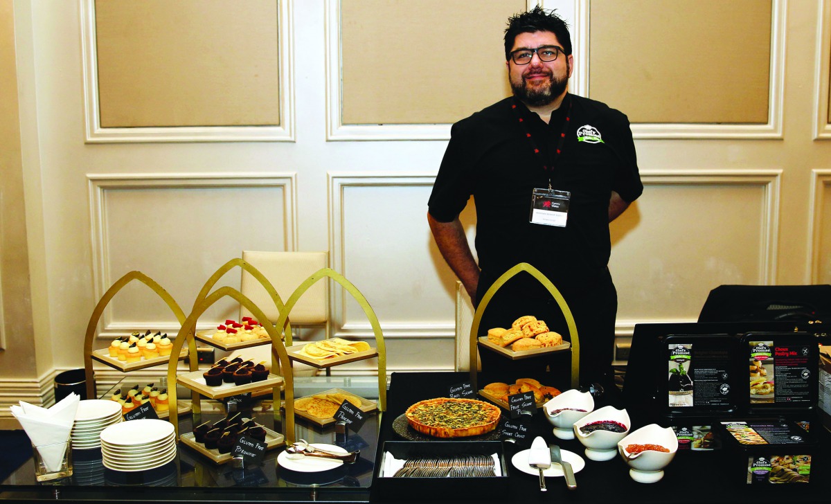 Massimo Bishop-Scotti, Head of Innovation at Prima Foods UK Limited, displaying his gluten-free products at an exhibition by the visiting Welsh trade delegation at the JW Marriott Hotel yesterday. Pic: Qassim Rahmatullah/the peninsula