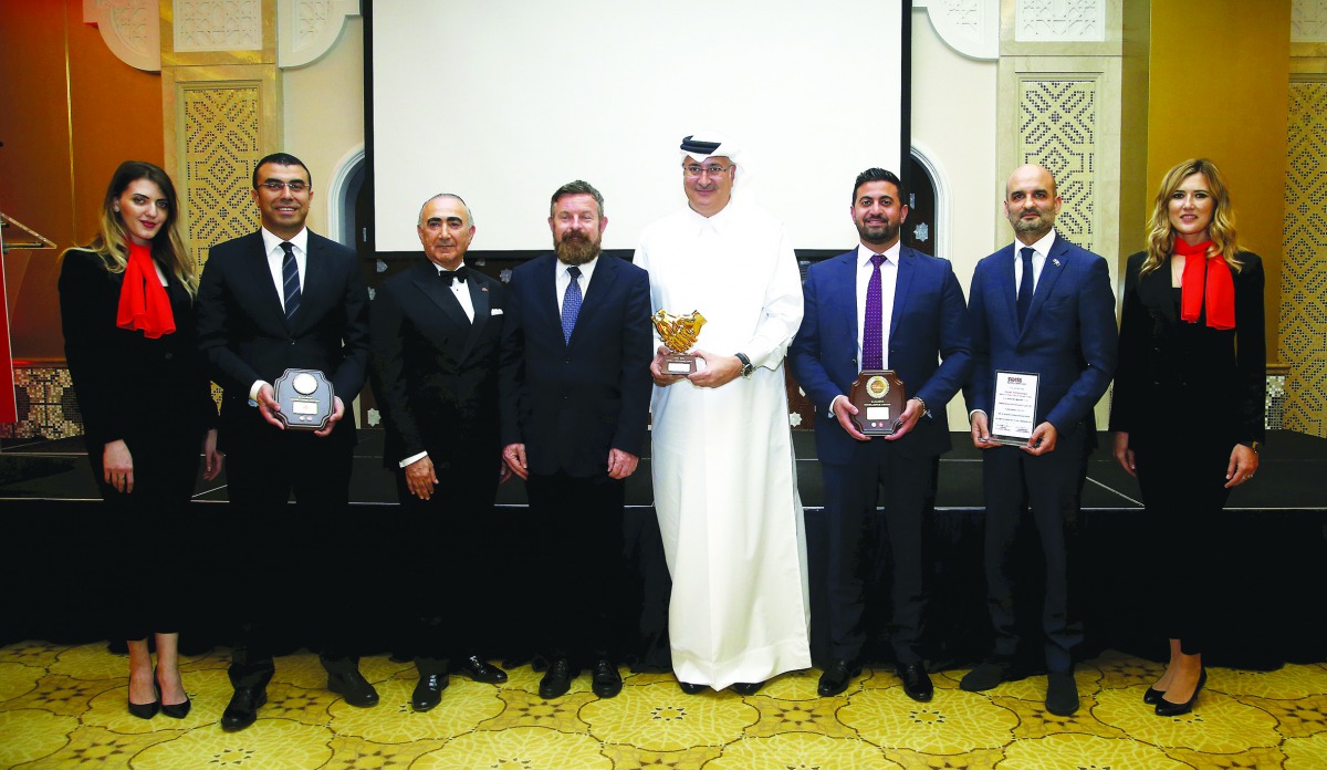 Swiss Ambassador to Qatar, Edgar Doerig (fourth left); Fariborz Samadian (third left), President, Swiss Business Council Qatar (SBCQ); Houtan Homayounpour (second right), Head of ILO Project Office for Qatar; with the SBCQ 2019 Awardees, Ashraf Abu Issa (