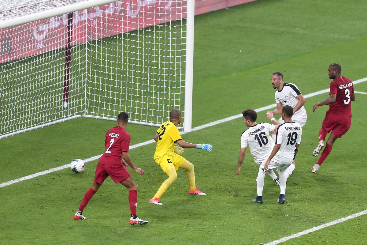 Qatar’s defender Abdelkarim Hassan (right) scoring a goal against Yemen during the 24th Arabian Gulf Cup Group A match at the Khalifa International Stadium in Doha, yesterday. Picture: Mohamed Farag