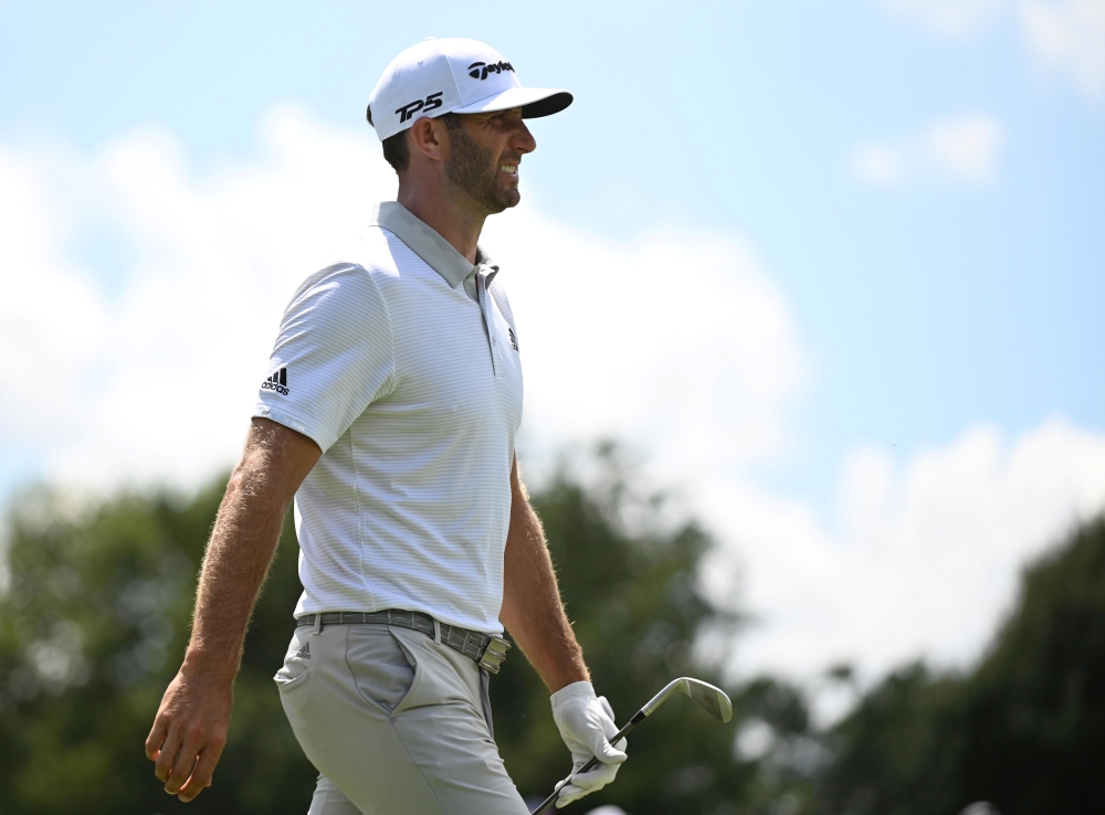 Aug 22, 2019; Atlanta, GA, USA; Dustin Johnson after putting on the 1st green during the first round of the Tour Championship golf tournament at East Lake Golf Club. Mandatory Credit: Adam Hagy-USA TODAY Sports