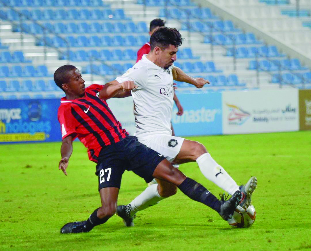 Al Sadd’s Baghdad Bounedjah (right) vies for the ball against an Al Rayyan player during their 2019 Ooredoo Cup Group A match played the Saud bin Abdul Rahman Stadium yesterday