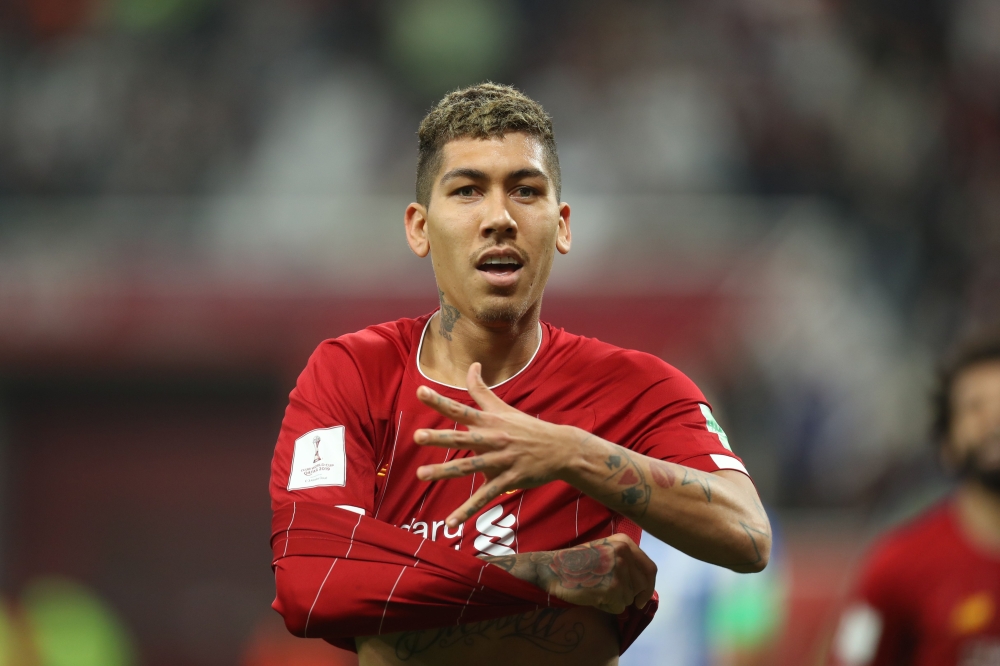 Liverpool's Brazilian midfielder Roberto Firmino celebrates his goal during the 2019 FIFA Club World Cup semi-final football match between Mexico's Monterrey and England's Liverpool at the Khalifa International Stadium in Doha on December 18, 2019. AFP / 