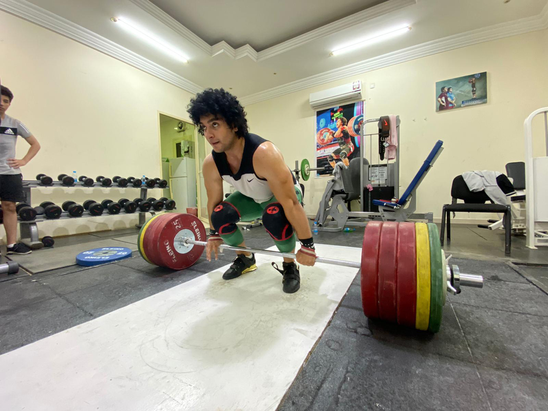 Qatari weightlifter Fares Ibrahim Hassouna trains ahead of the 6th edition of Qatar International Cup which kicks off in Doha today