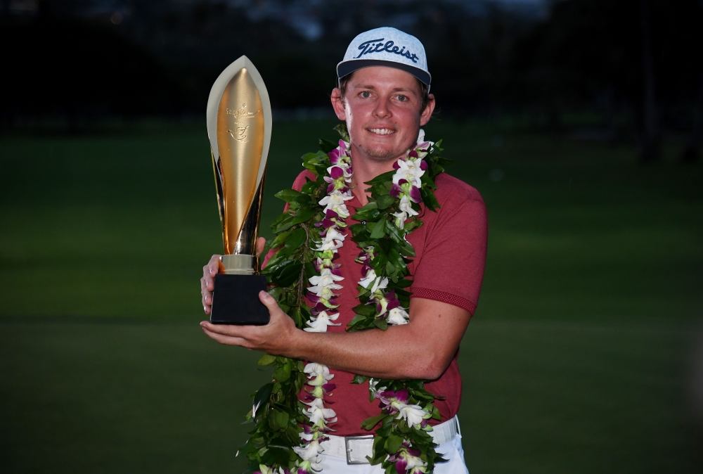 HONOLULU, HAWAII - JANUARY 12: Cameron Smith of Australia celebrates with the winner's trophy after the final round of the Sony Open in Hawaii at the Waialae Country Club on January 12, 2020 in Honolulu, Hawaii. Harry How/AFP