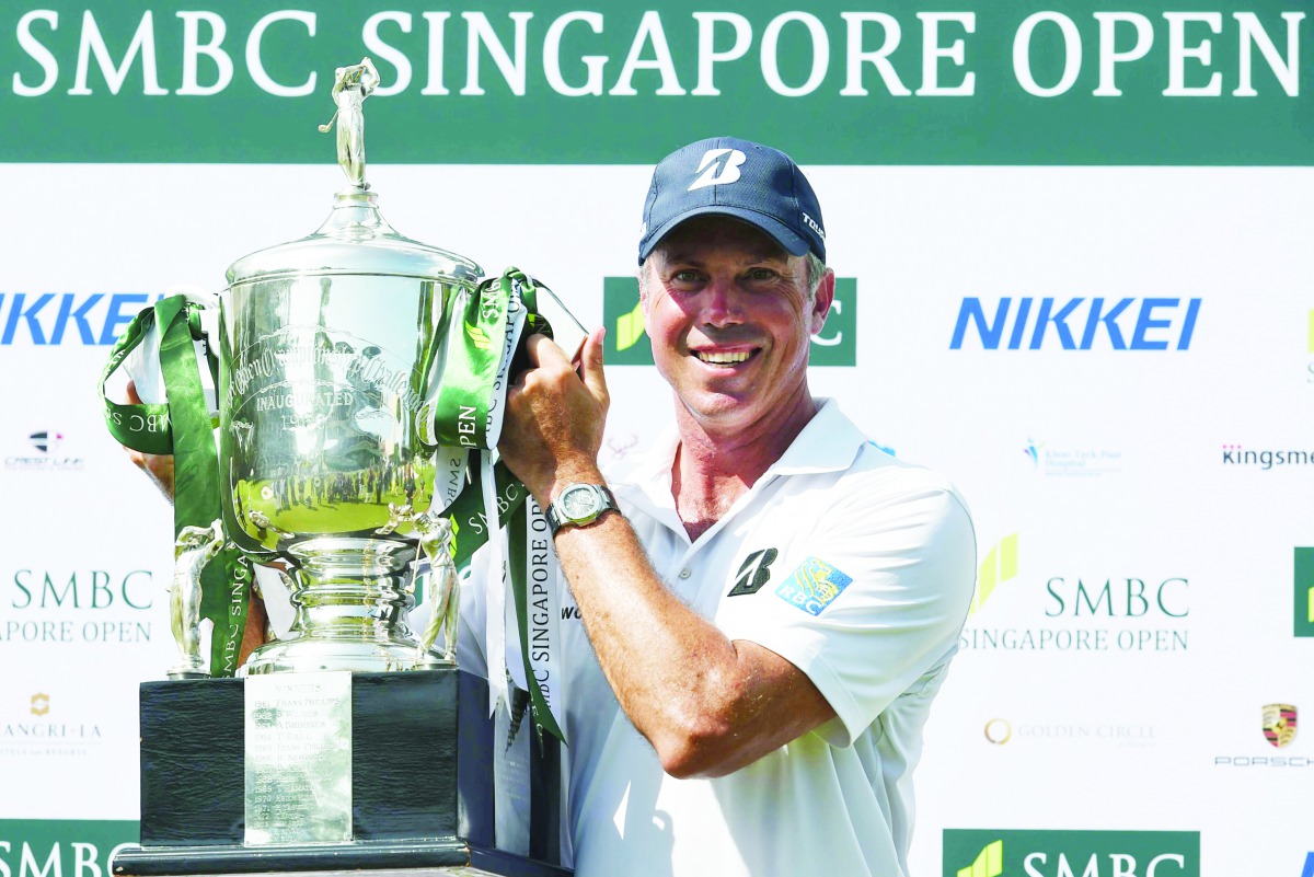 Matt Kuchar of the US poses with the trophy after winning the Singapore Open tournament at Sentosa golf club in Singapore on January 19, 2020. AFP / Roslan Rahman
