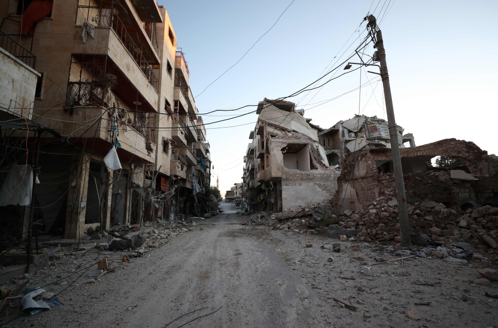 Damaged buildings that were hit during recent airstrikes by pro-regime forces in the jihadist-held city of Maaret al-Numan in Syria's northwestern Idlib province are pictured on January 25, 2020. AFP / Omar HAJ KADOUR