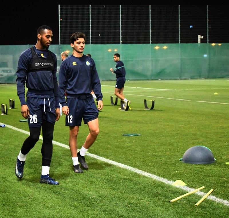 Al Gharafa striker Jonathan Kodjia (left) with his team-mate during a team's training session. 