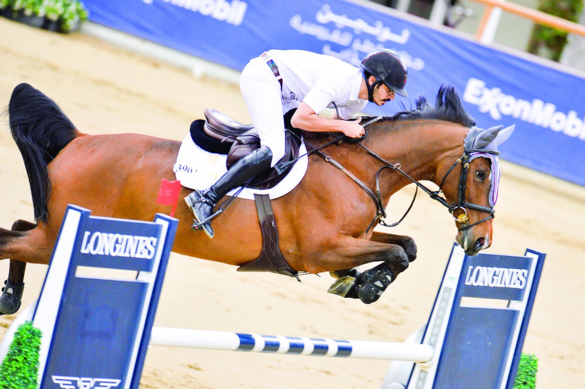 Hamad Nasser Al Qadi guiding Gibria-B over an obstacle during the Medium Tour event at the Longines Arena at Al Shaqab yesterday.