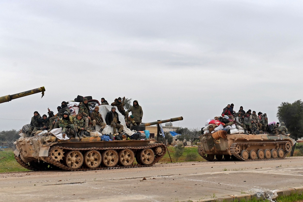 Syrian army troops advance towards the rebel-held areas of the northern Aleppo province on February 12, 2020. AFP 
