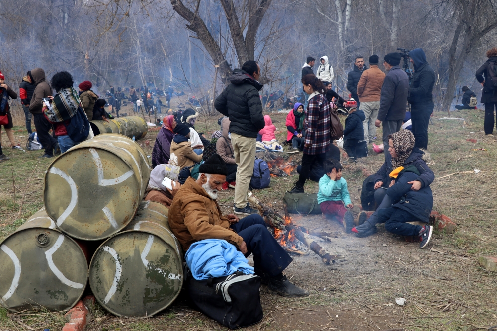 Migrants, who want to proceed to Europe wait at the Turkish side and the buffer zone between the Greek Kastanies and Turkish Pazarkule border gates, on February 29, 2020, Edirne, Turkey. Cihan Demirci - Anadolu 