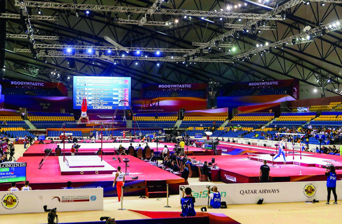 FIle picture of contestants competing in men's parallel bars qualification during the first of the 2018 FIG Artistic Gymnastics Championships at Aspire Dome in Doha. 