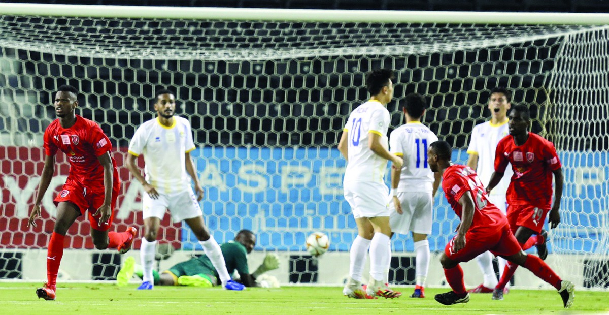 Al Duhail's Mohammed Muntari (left) celebrates after scoring the first goal against Al Gharafa, yesterday. 