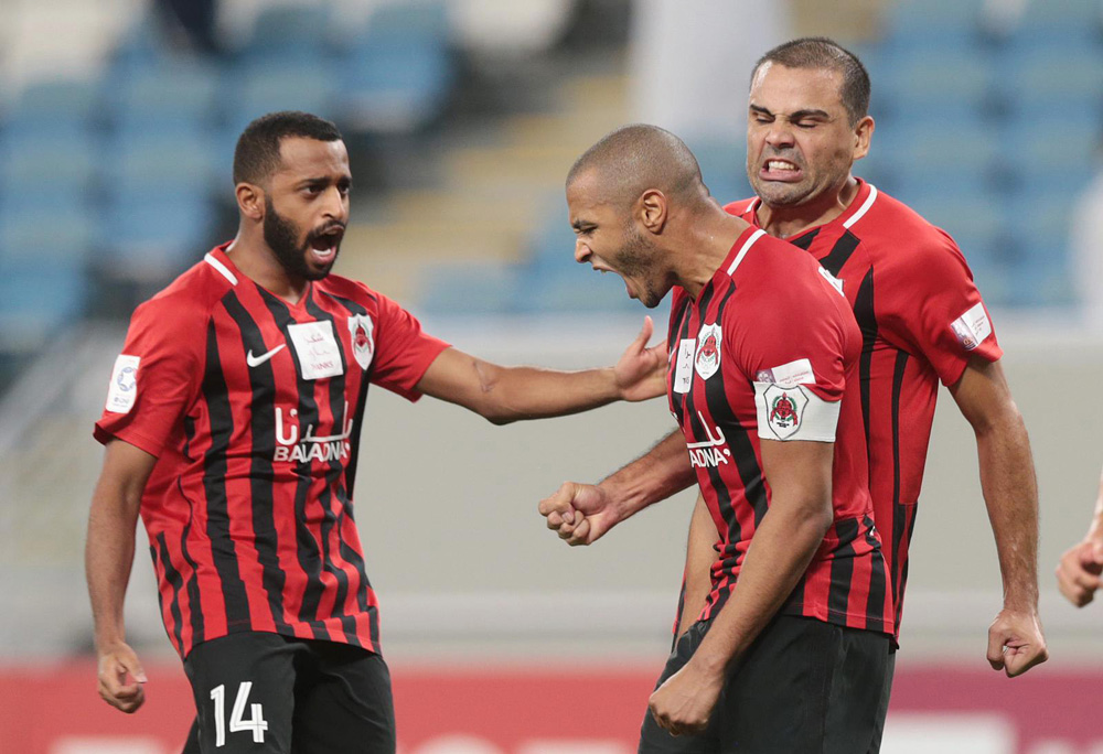 Al Rayyan's Yacine Brahimi (centre) celebrating with team-mates after scoring their winning goal against Al Shahania yesterday.