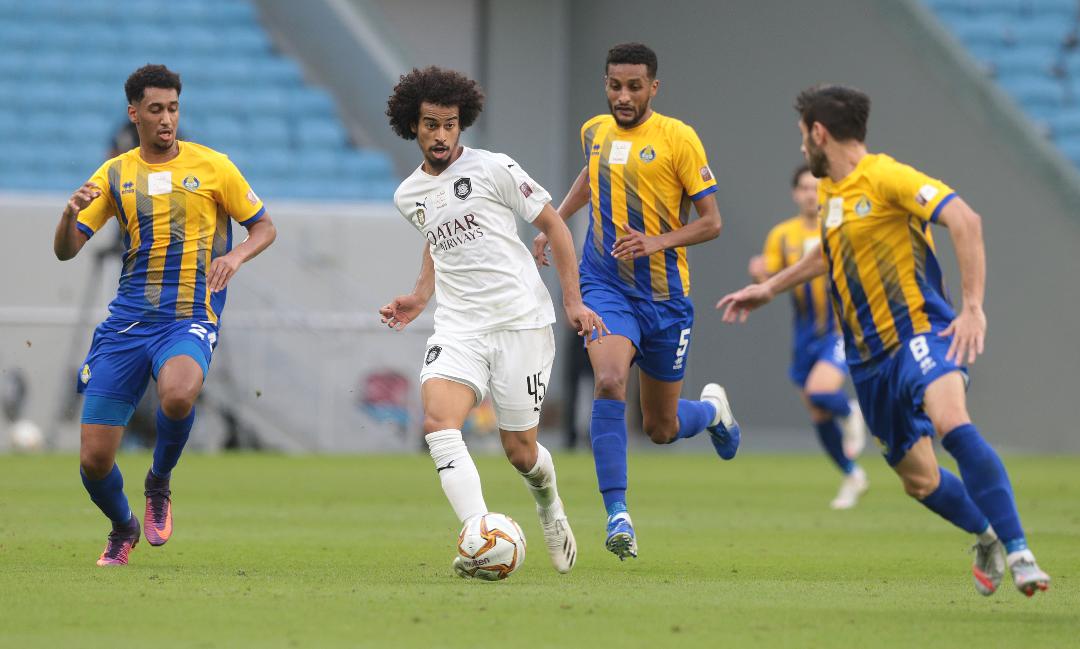 Al Sadd's Akram Afif in action against three Al Gharafa players during their Round 22 match yesterday.