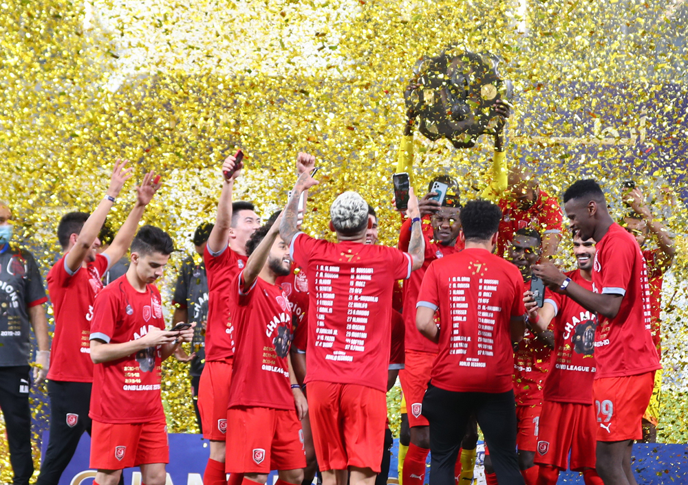 Al Duhail's players celebrate after winning the QNB Stars League title at Al Janoub Stadium, on Friday. 