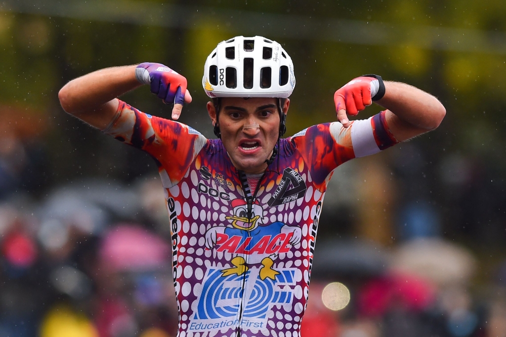 Team Education First rider Portugal's Ruben Guerreiro celebrates as he crosses the line and wins the 9th stage of the Giro d'Italia 2020 cycling race, a 208-kilometer route between San Salvo and Roccaraso on October 11, 2020. / AFP / DARIO BELINGHERI